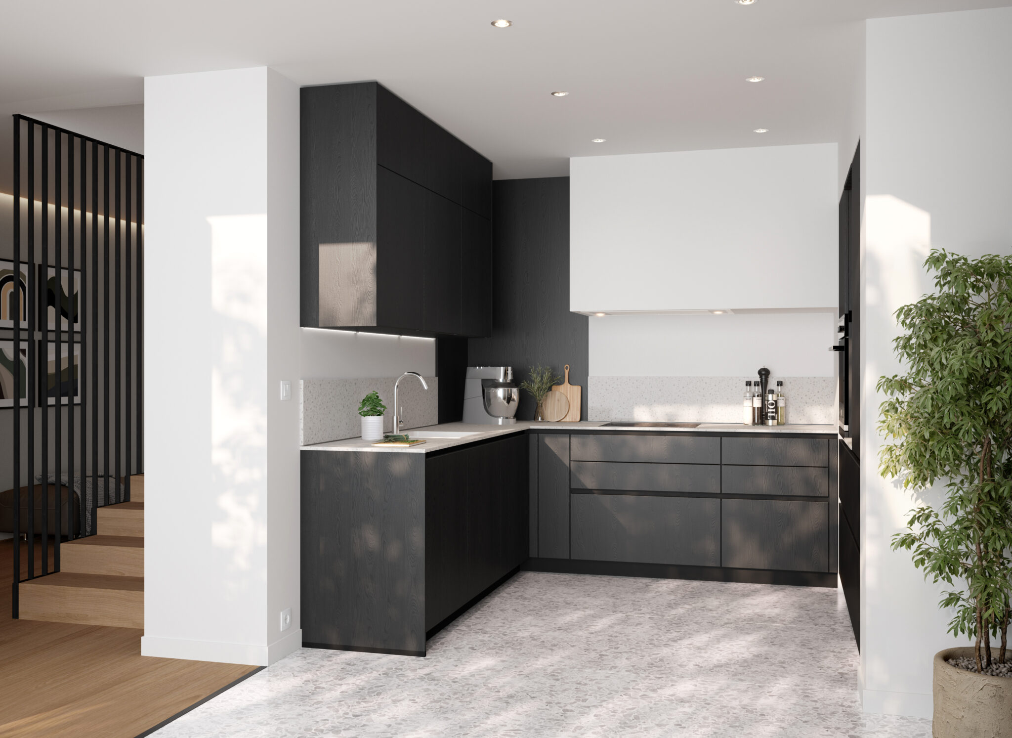 Cuisine moderne avec armoires noires, plan de travail blanc, et accessoires en acier inoxydable, éclairée par des spots au plafond.